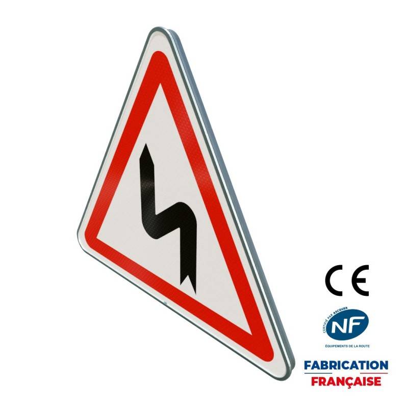 Panneau de danger A1d Succession de virages dont le premier est à gauche